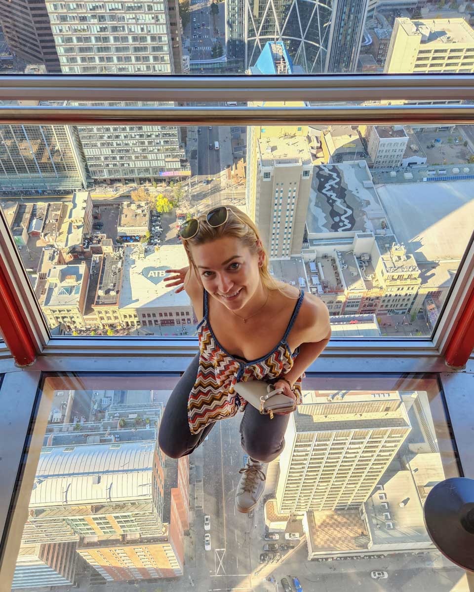 Bailey stands on the glass viewing deck on the Calgary Tower