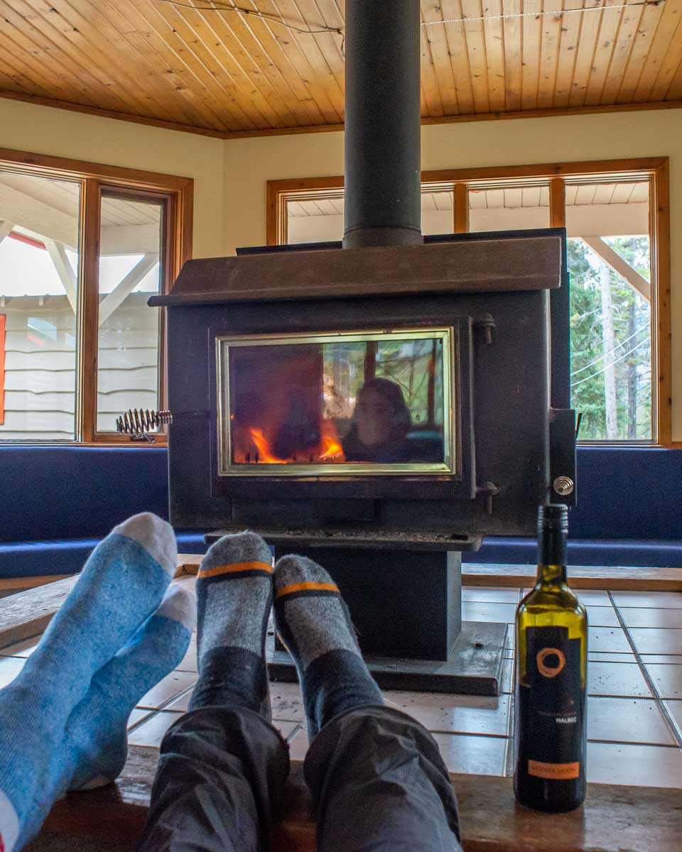 Cozy fire indoors at HI Mosquito Creek, Icefields Parkway