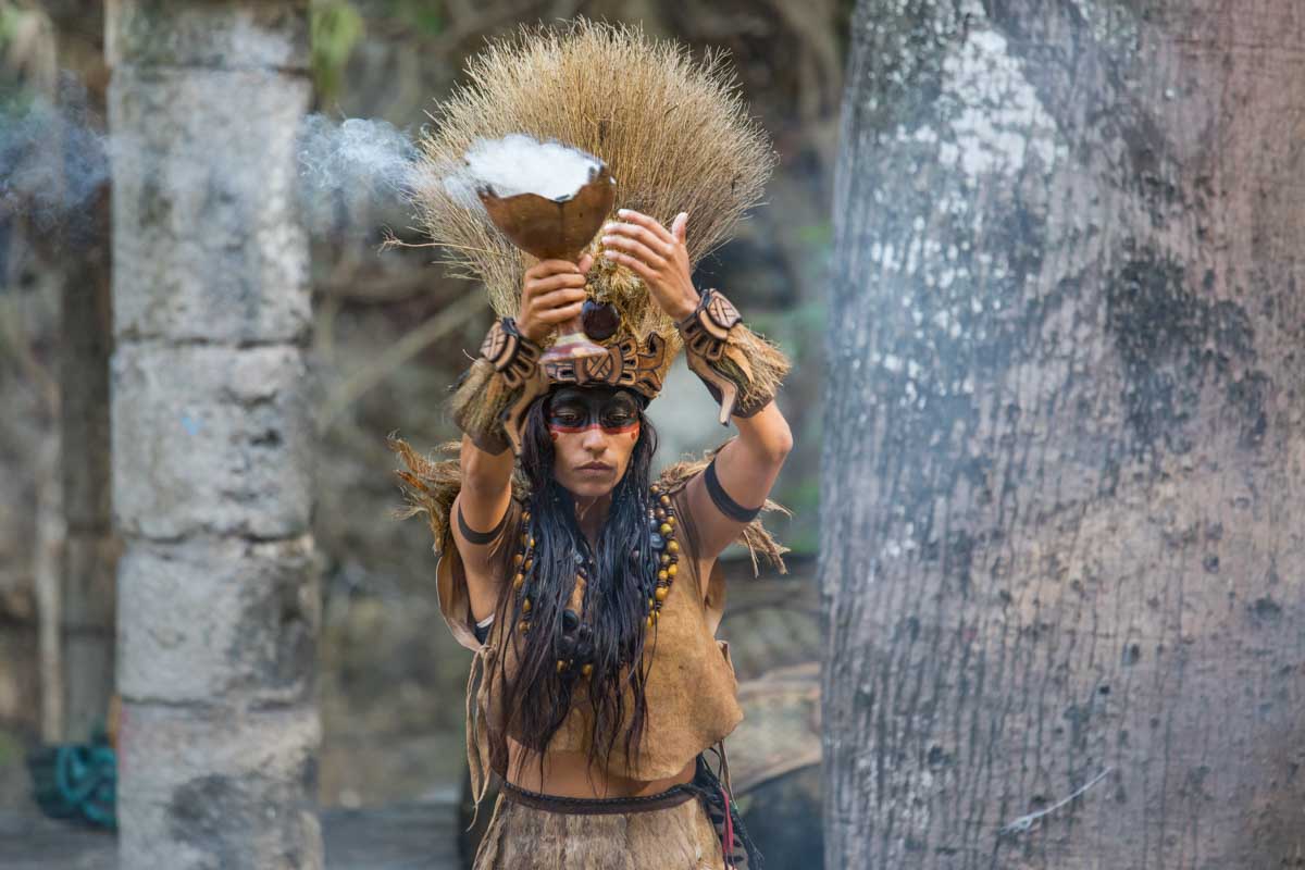 Young woman dressed in mayan costume.