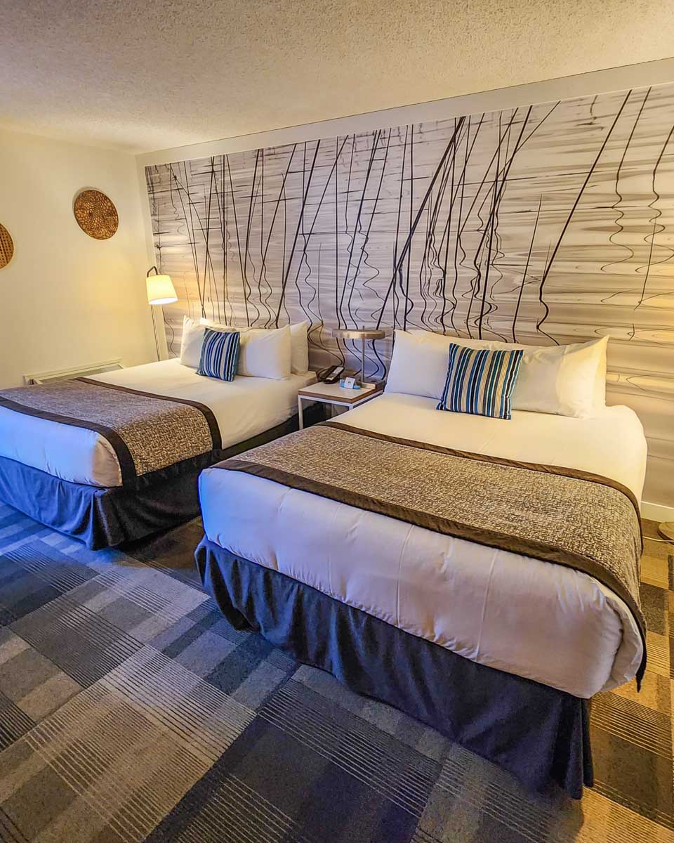 two beds in a room at Coast Canmore