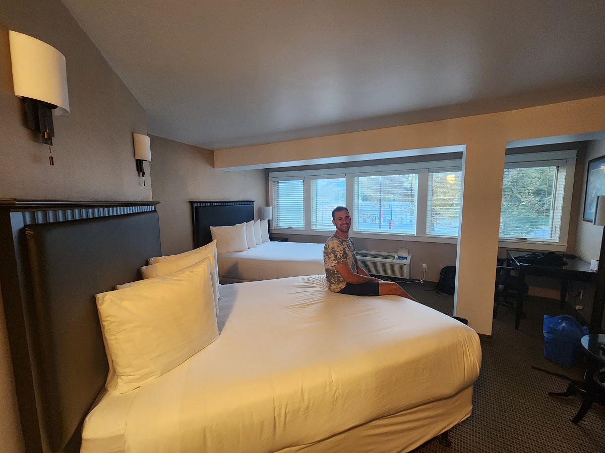 the double room at Ascend Hotel Penticton with Daniel on the bed