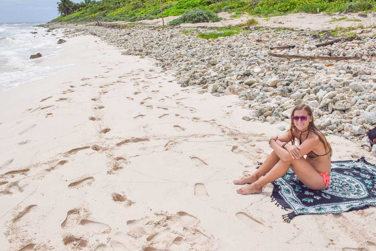 A lady relaxes on a beach in Cancun Mexico by herself