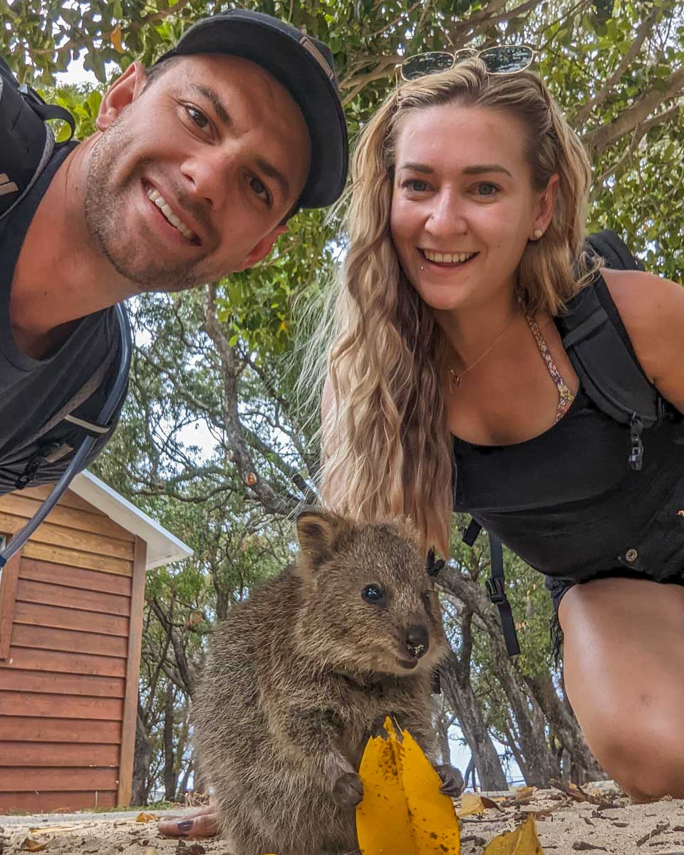 Bailey and Daniel take a selfie with a quokka on Rottnest Island, Perth