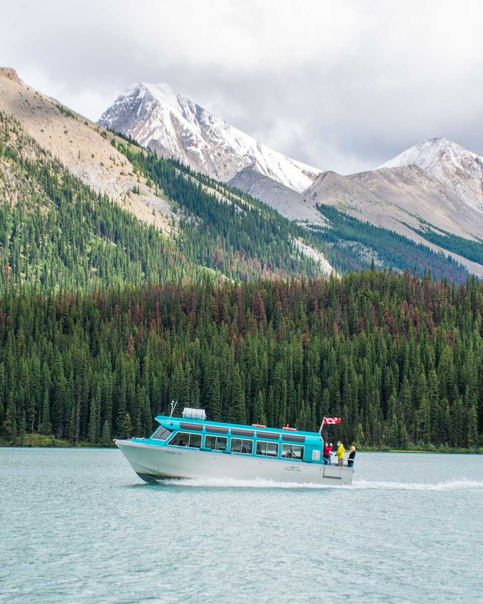 A boat travels to Spirit Island on a cruise from Maligne Lake, Jasper