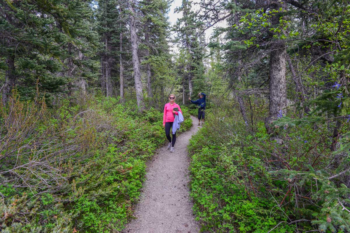 Bailey and her dad walk a trail in Bow Valley Provincial Park