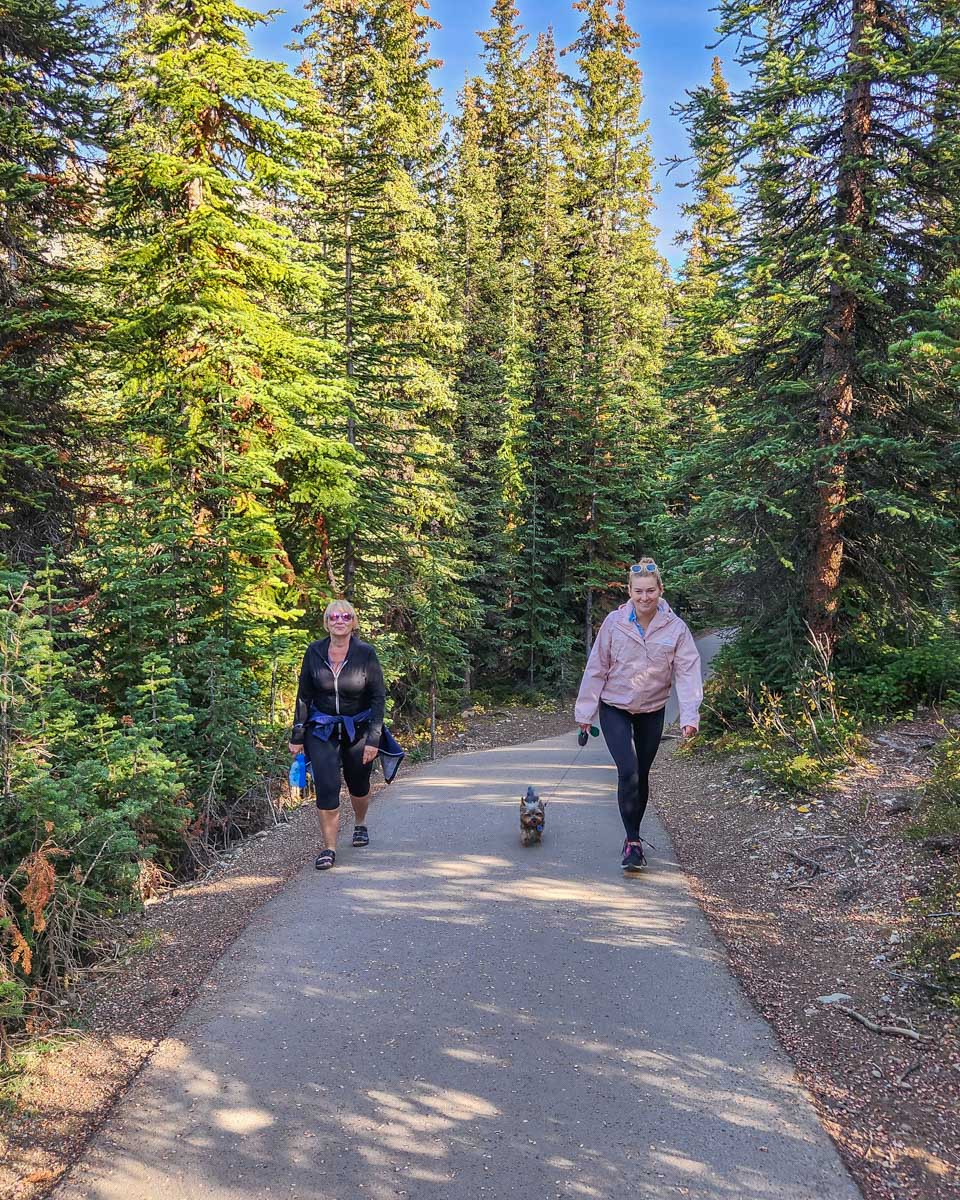 Bailey and her mum walk along the pathway to the Peyto Lake Viewpoint in Banff National Park