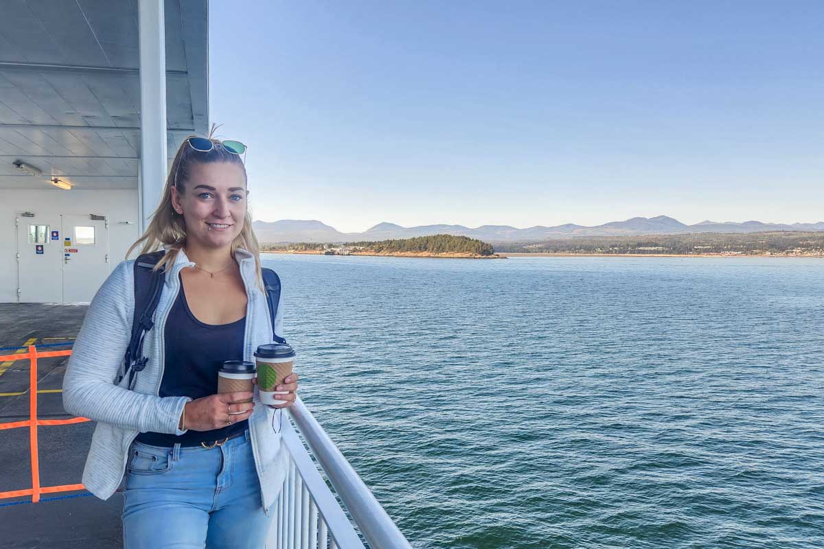 Bailey enjoys a coffee on the outside deck of a BC Ferry to Vancouver Island