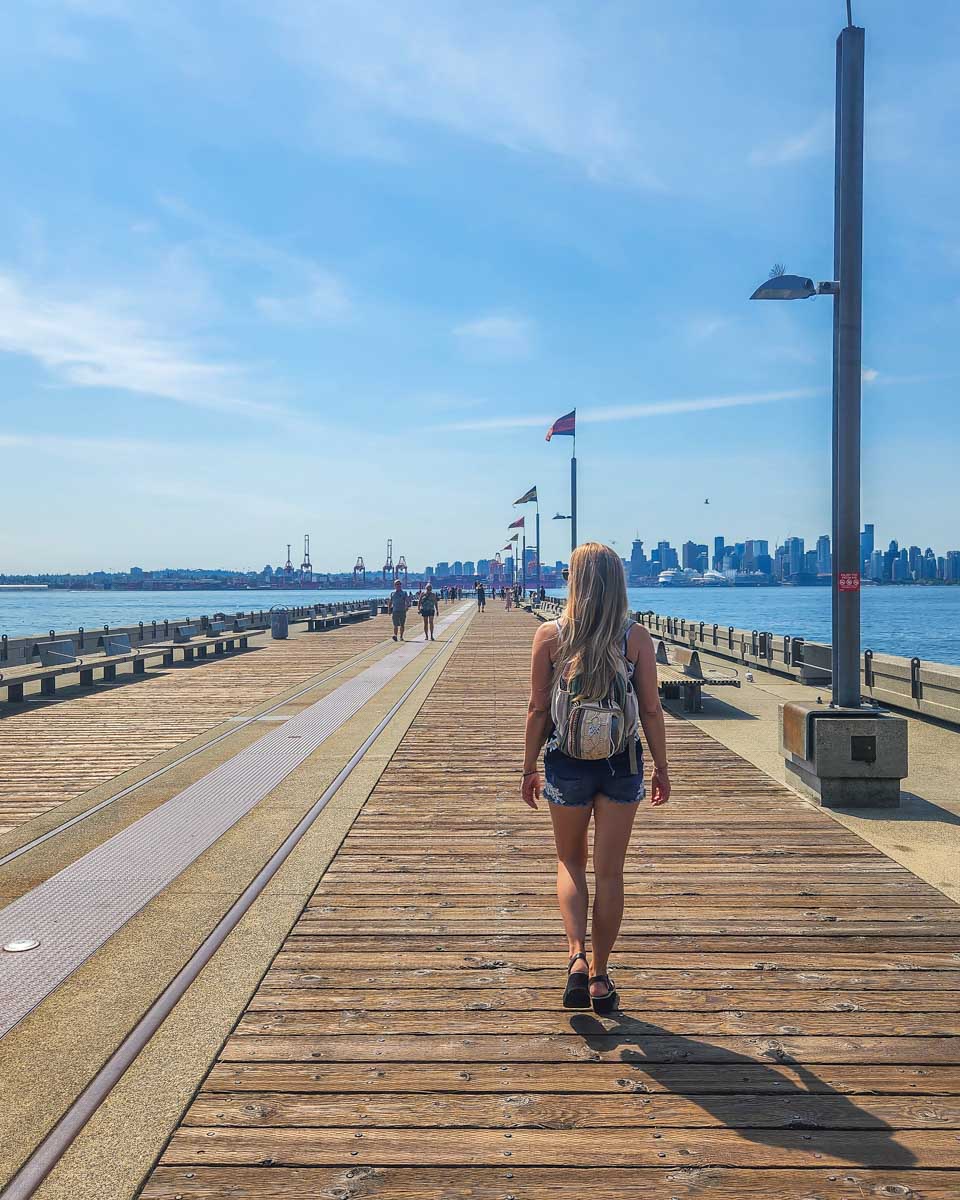 Bailey walks the Burrard Dry Dock Pier in Lonsdale Quay, Vancouver