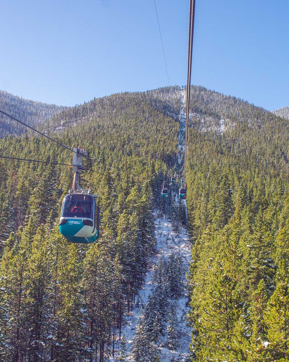 Cable cars travel up the Banff Gondola