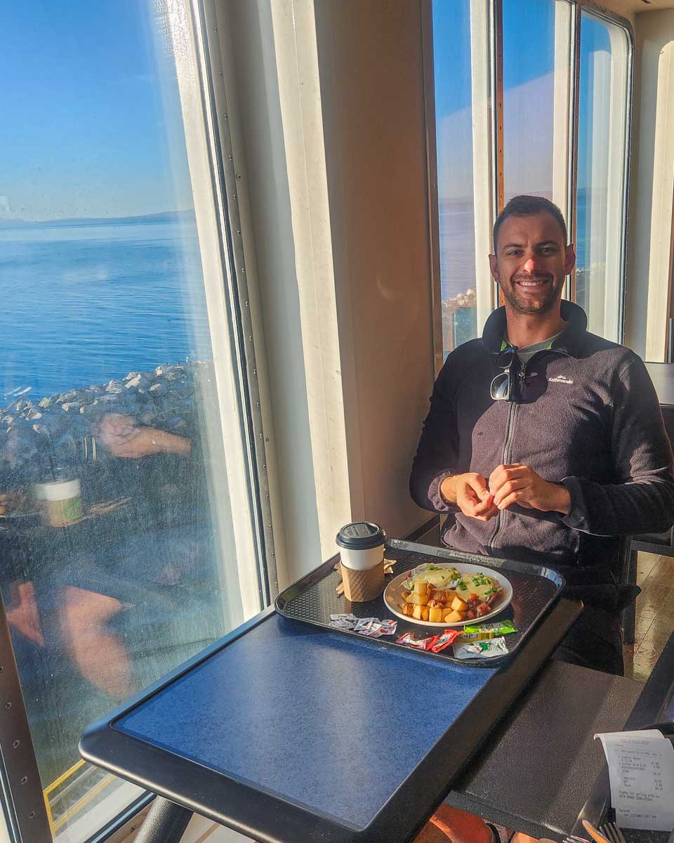Daniel eats a Eggs Benedict on a BC Ferry to Vancouver Island