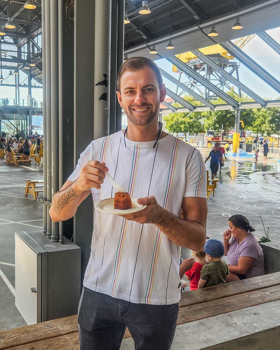 Daniel enjoys Honey Cake at Main Street Honey Shoppe at The Shipyards 