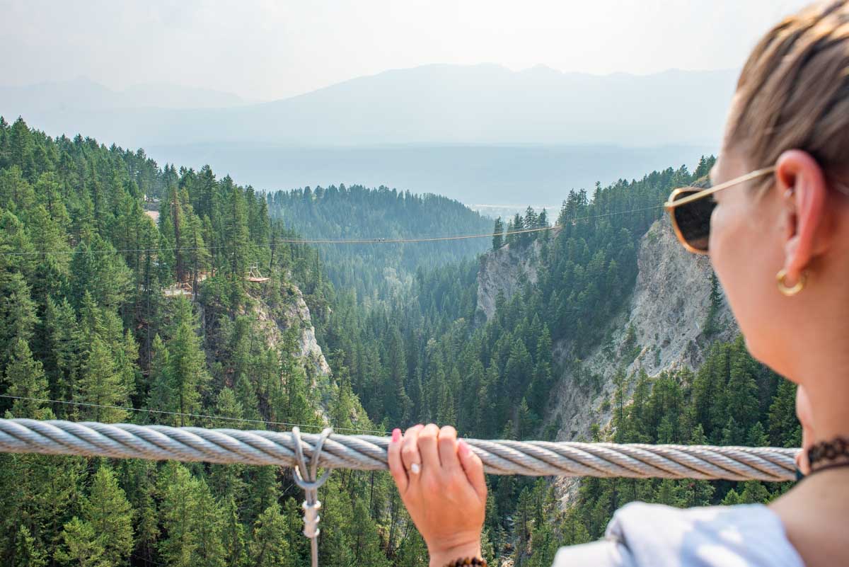 Bailey looks over the edge of the Golden Suspension Bridge in Golden, BC