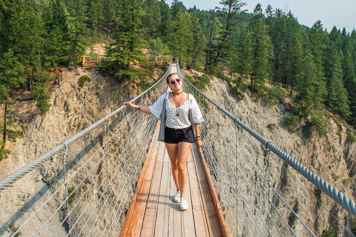 Bailey smiles at the camera at the Golden Suspension Bridge in Golden, BC