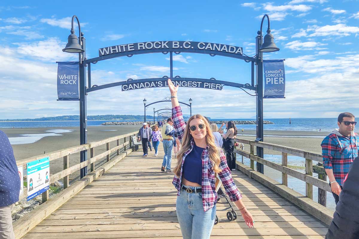 Bailey stands at the White Rock Pier in White Rock, BC