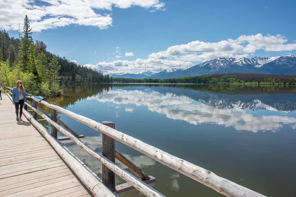 Bailey walks along the bridge to Pyramid Lake in Jasper National Park, Canada