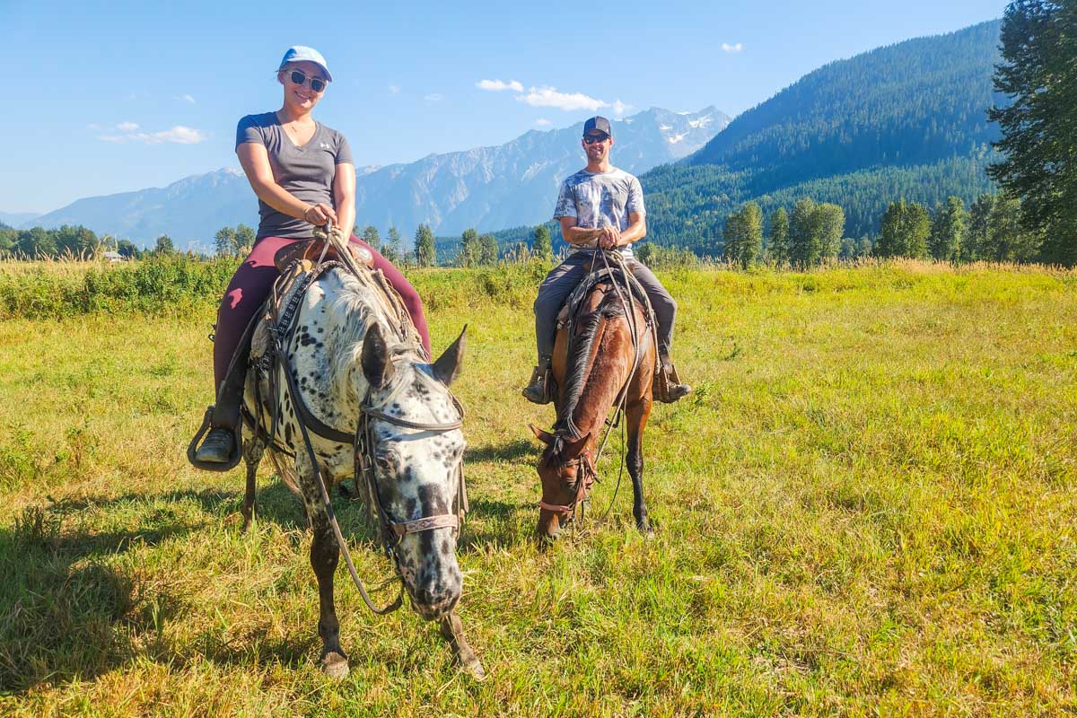Daniel and Bailey pose for a photo on their horses in Pemberton BC