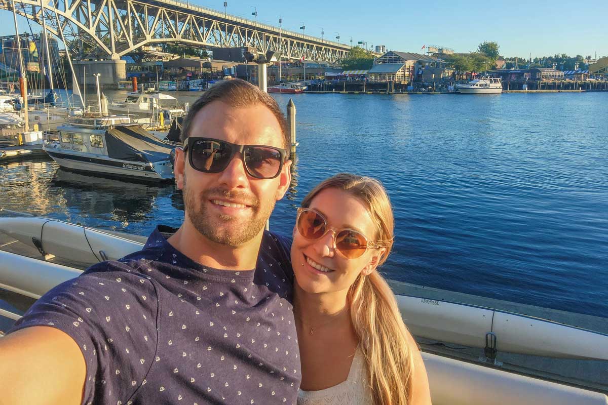 Daniel and Bailey take a selfie on the water in Yaletown, Vancouver
