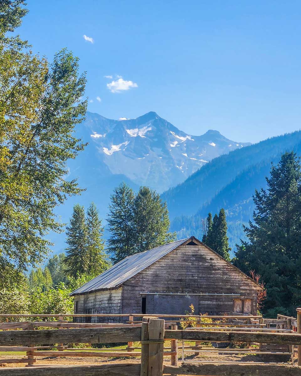 Horse stable in Pemberton, BC with a mountain backdrop in Canada