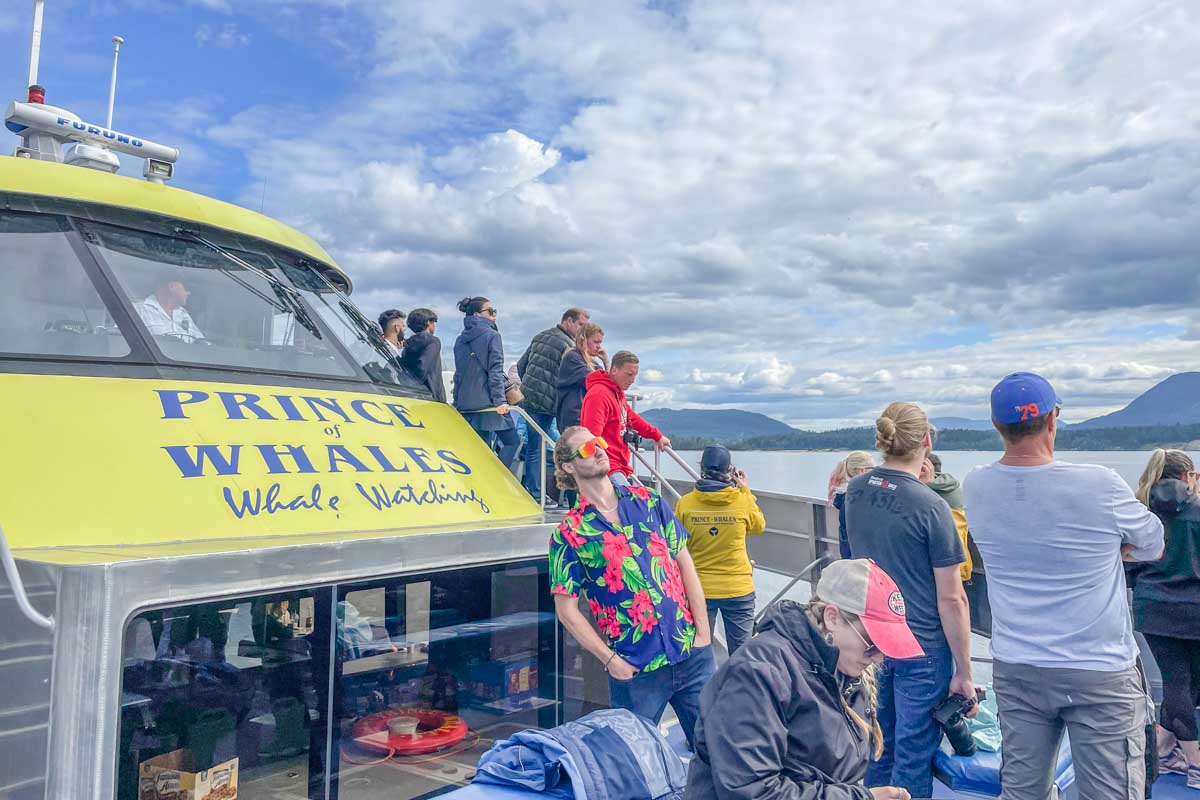 My friend makes a funny pose on a whale watching boat in Vancouver, Canada