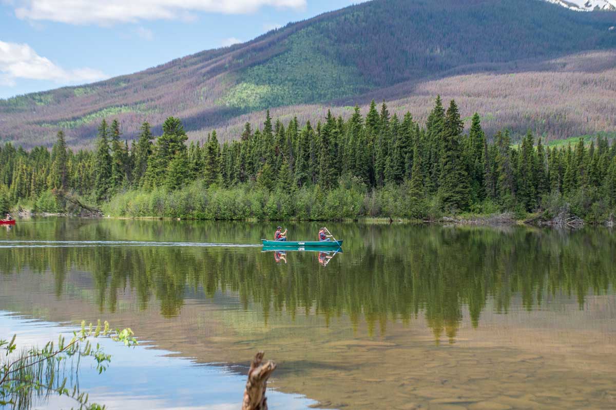 People canoe at Pyramid Lake in Jasper National Park, Canada