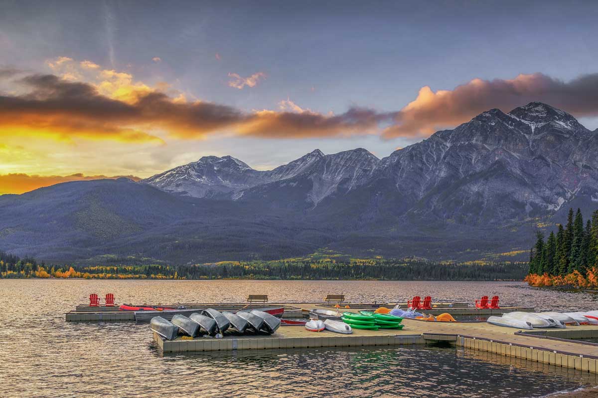 Sunset at the docks and red chairs at Pyramid Lake in Jasper National Park, Canada