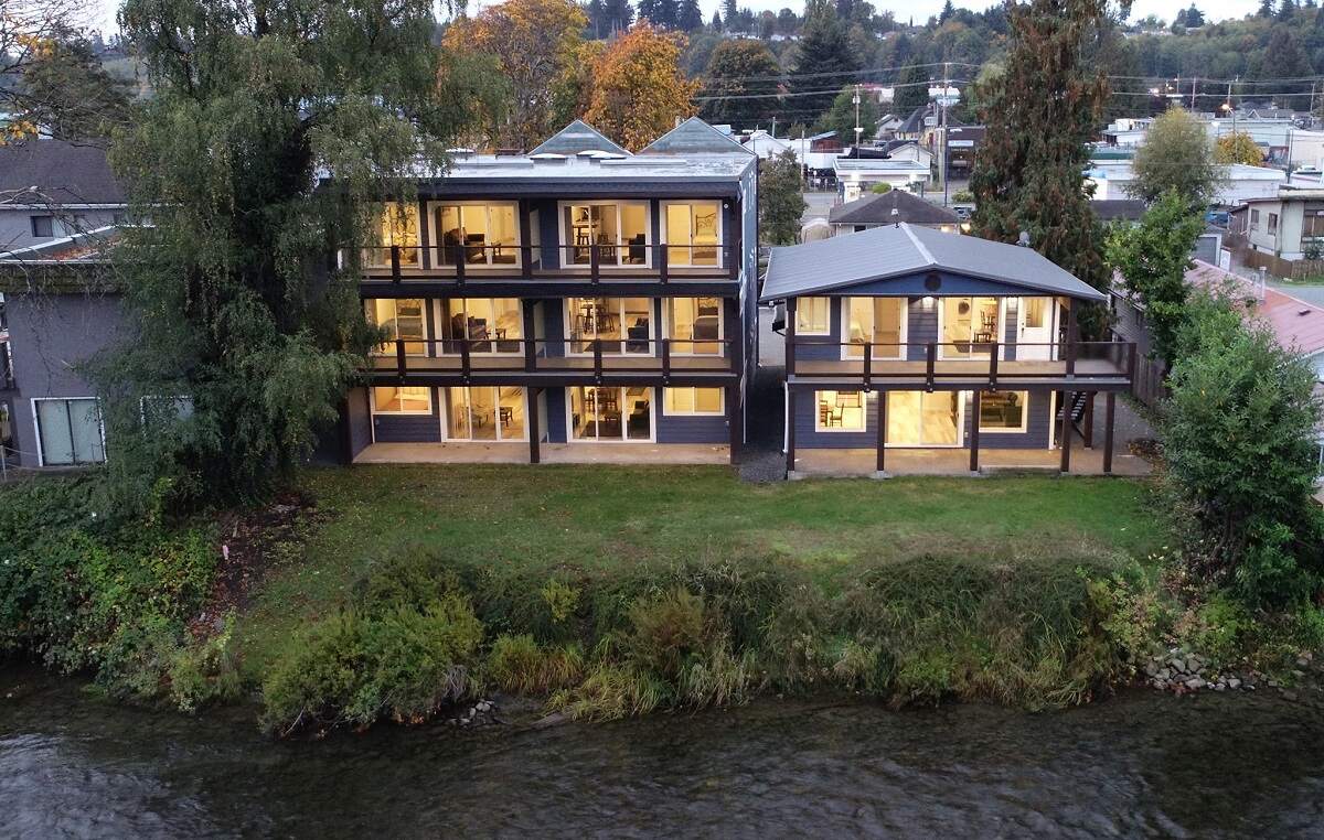 view of the outside of a three storey hote, Chateau Riverside, on the edge of a river