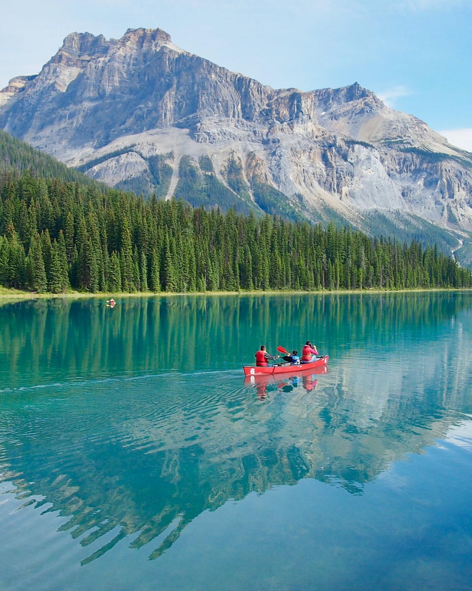A person canoes on Emerald Lake in Yoho National Park, Canada
