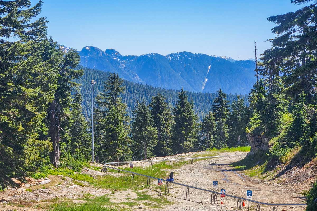 the Cypress Mountain Coaster track near Vancouver, BC with mountains in the distance