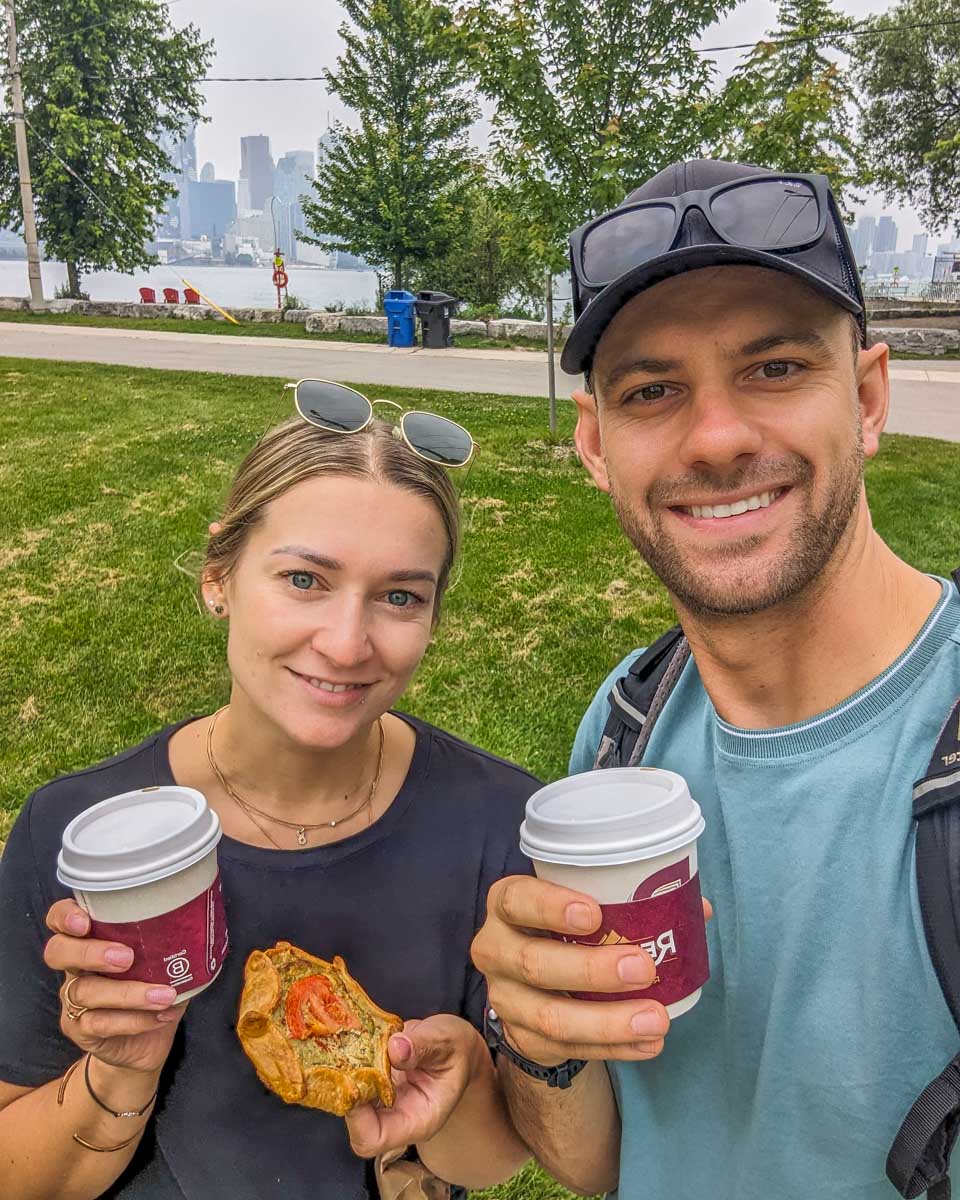 Bailey and Daniel enjoy a coffee from River Cafe on the Toronto Islands