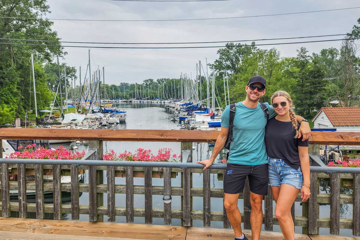 Bailey and Daniel pose for a photo on a small bridge on the Toronto Island in Canada