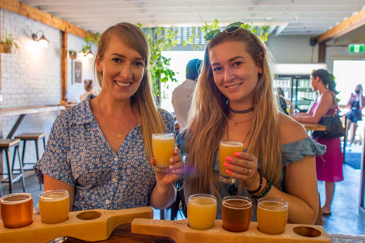 Bailey and her friend taste beer at a brewery in Vancouver