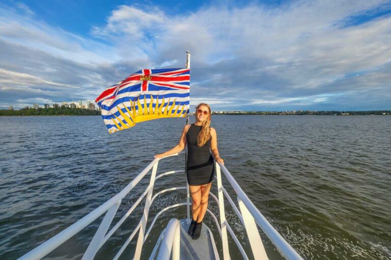 Bailey at the front of the boat on a sunset cruise in Vancouver