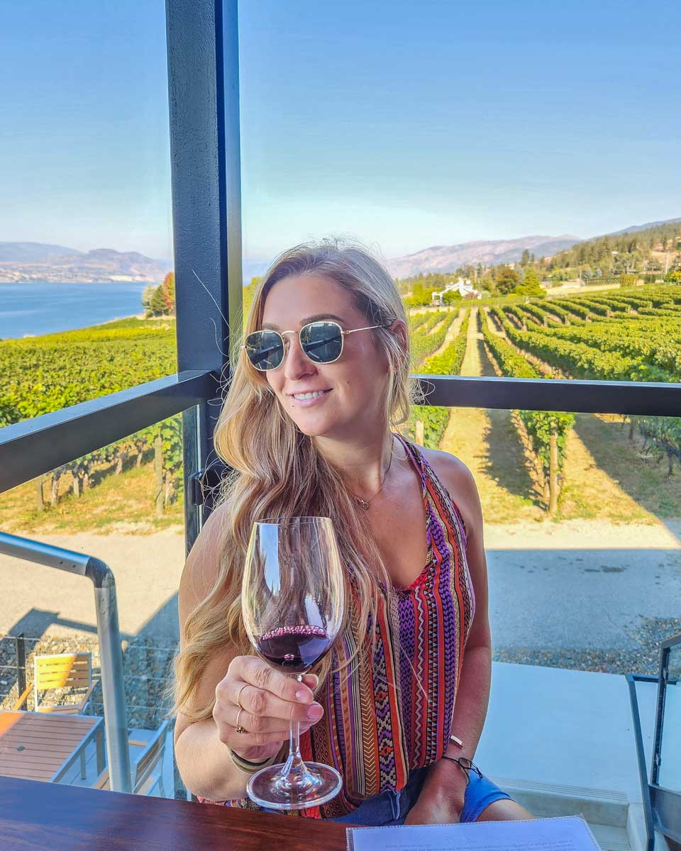 Bailey enjoys a glass of wine with views of the lake in Penticton, Canada