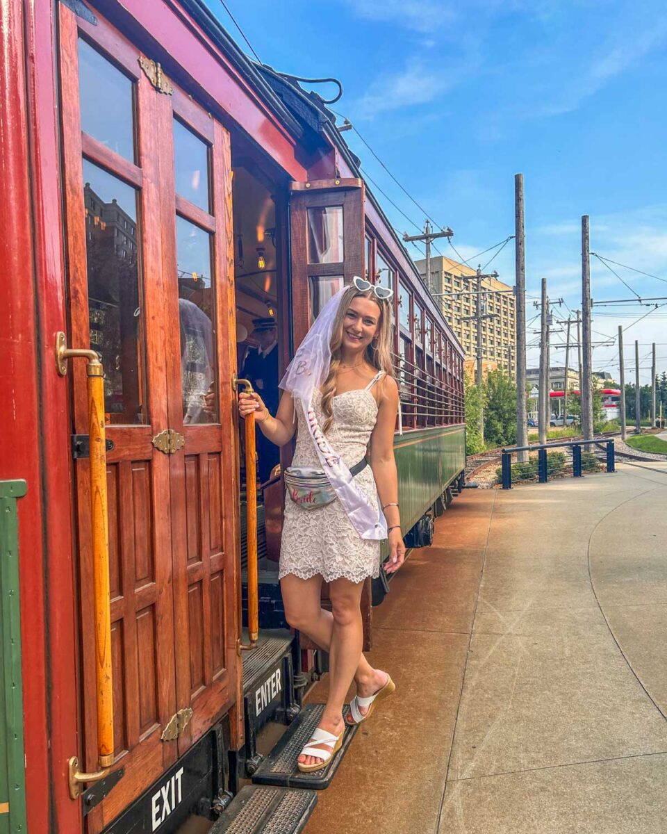 Bailey poses on the outside of the high level bridge street car