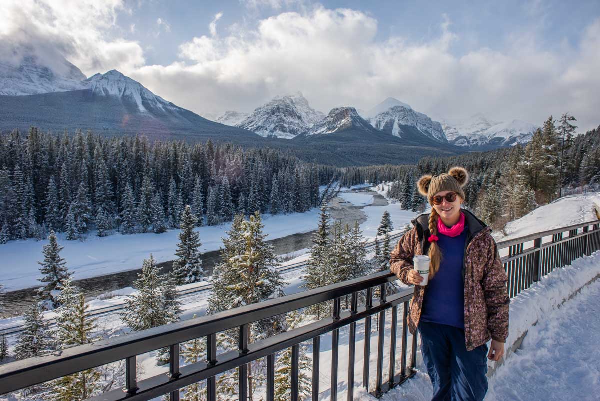 Bailey sips a coffee at Morant's Curve along the Bow Valley Parkway
