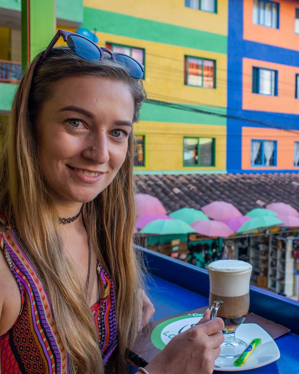 Bailey sips a coffee in Guatape, Colombia