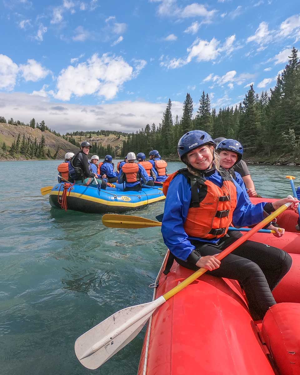 Bailey smiles at the camera while white water rafting in Canmore, Alberta
