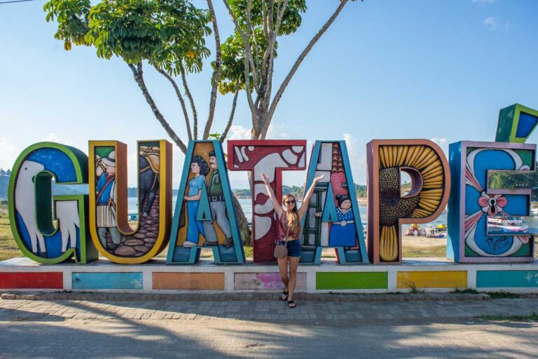 Bailey takes a photo with the Guatape sign