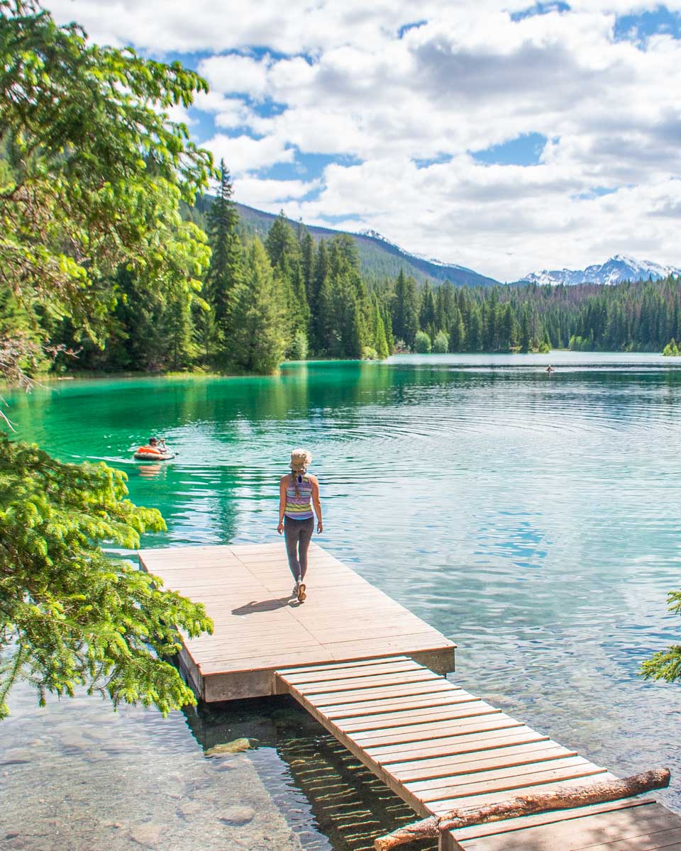 Bailey walks out onto a dock at the Valley of the 5 Lakes in Jasper