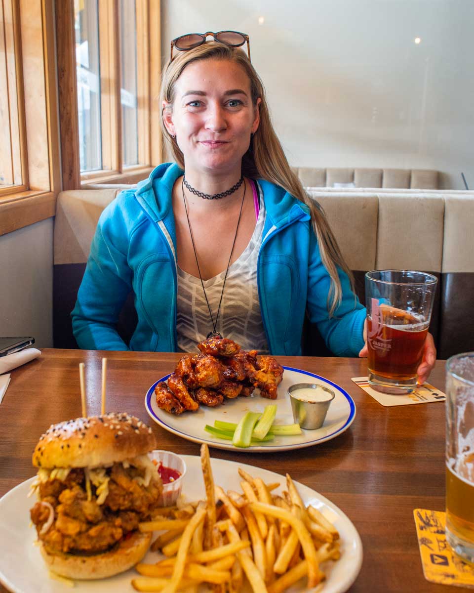 Bailey with her food and beer at Jasper Brewing Company