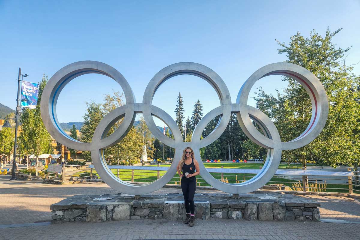 Bailey with the Whistler Olympic rings in Whistler Town