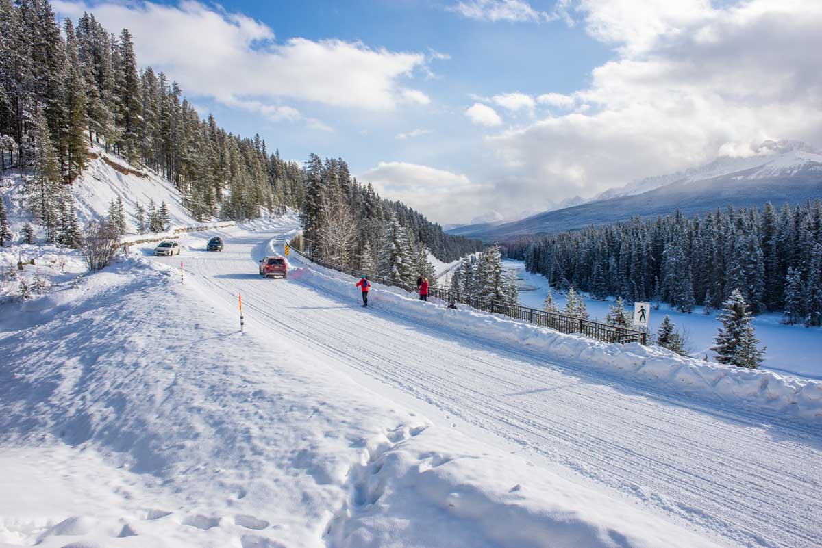Bow Valley Parkway road in winter covered in snow