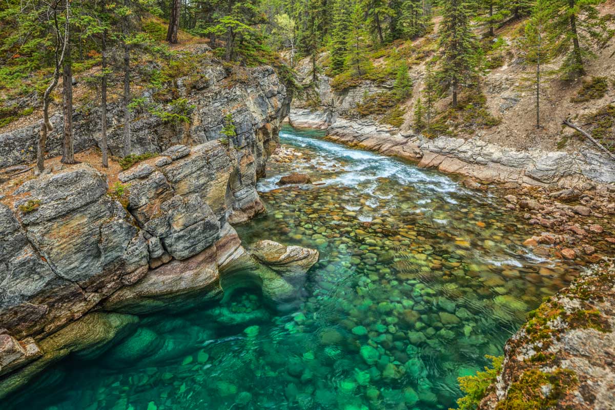 Clear green water in Johnston Canyon