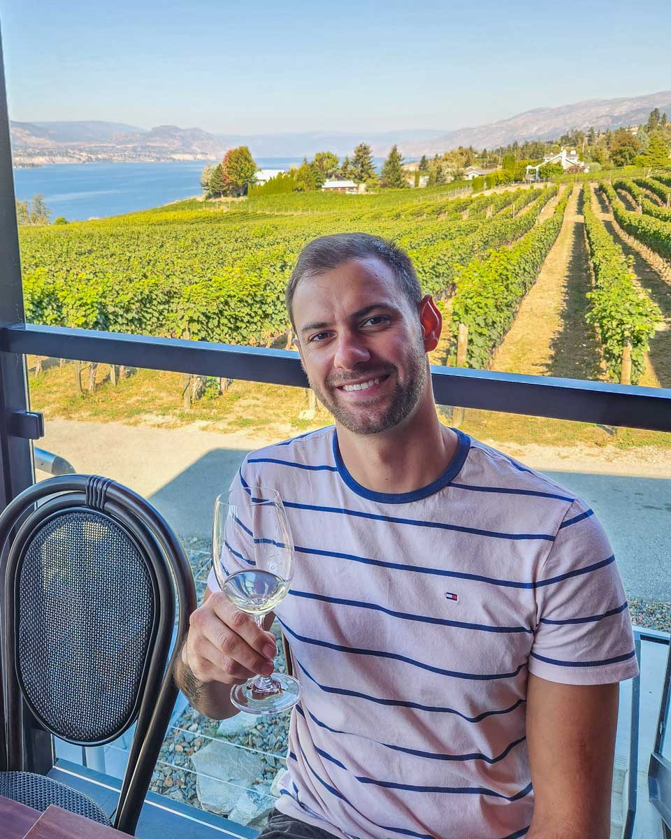Daniel enjoys a wine tasting at a winery in Naramata Bench, on a wine tour from Penticton