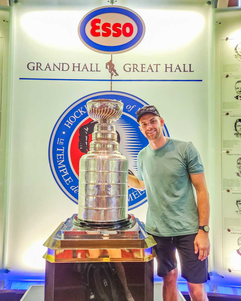 Daniel poses for a photo with the current Stanley Cup at the Hockey Hall of Fame in Toronto, Canada