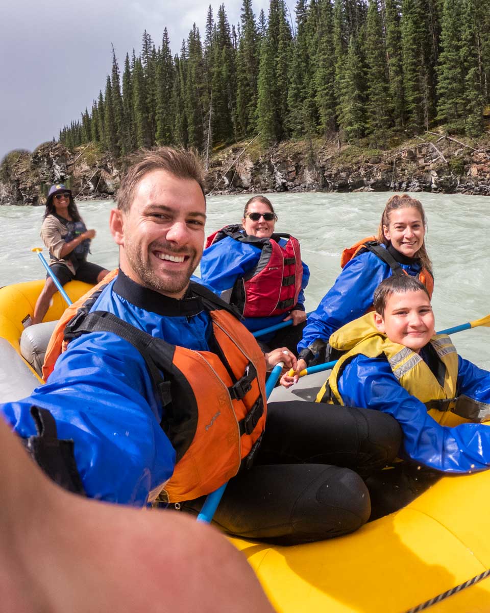 Daniel takes a selfie while white water rafting in Jasper, Canada