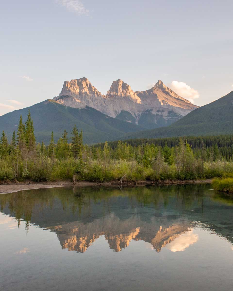 Reflections of the famous Three Sisters in Canmore
