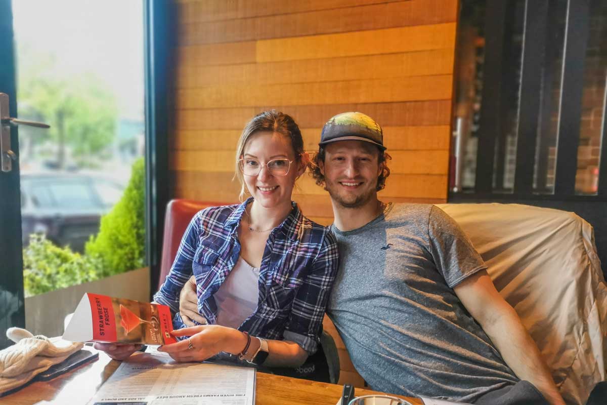 Two people pose for a photo while out for drinks in Kitsilano