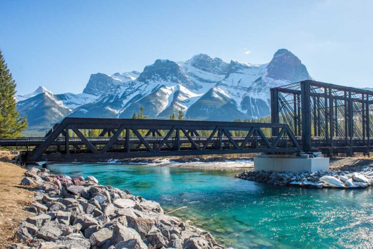 Walking the Bow River Loop Trail with views of the Historic Engine Bridge in Canmore, Alberta