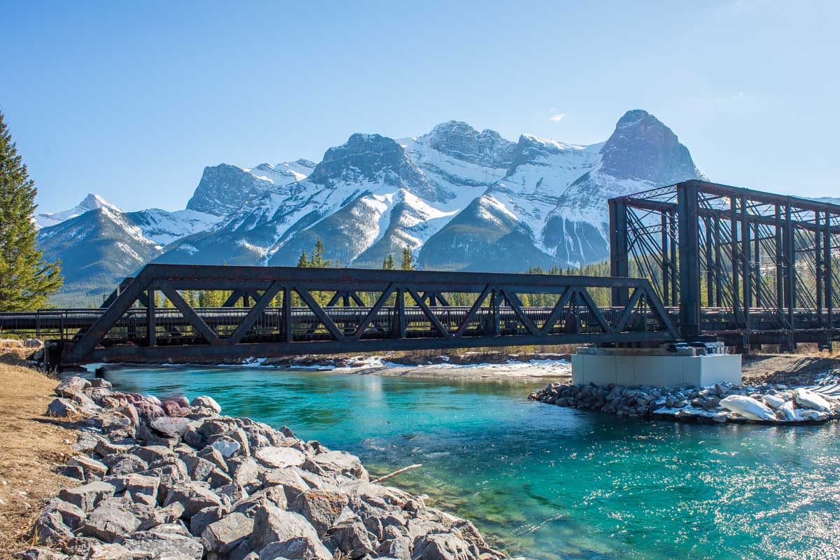 Walking the Bow River Loop Trail with views of the Historic Engine Bridge in Canmore, Alberta